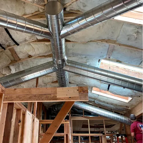 Comfort One | Indoor Air Quality Service Phoenix, AZ 1 EPA certified technician Henri installing ductwork, a part of our indoor air quality services in Phoenix Arizona