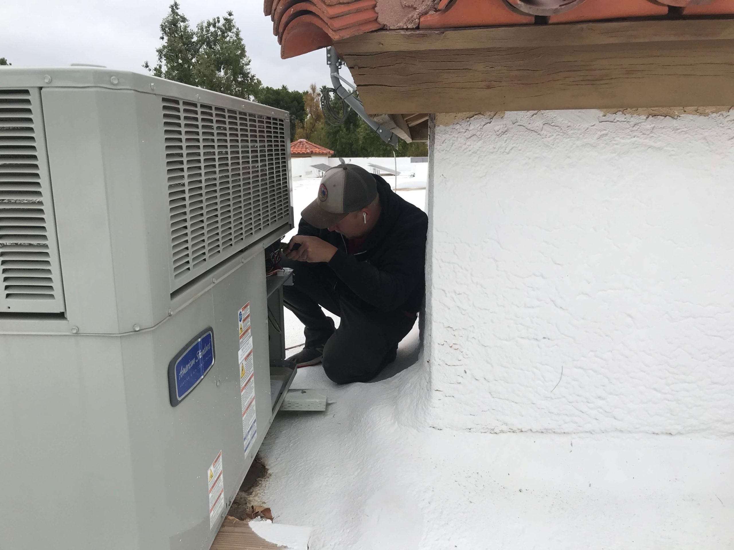 Diagnosing AC compressor issues through visual inspection and using manifold gauges.